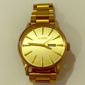 Nixon gold Men’s watch
